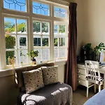 Spacious And Sunny Master Bedroom With Shared Bathrooms