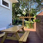 Spacious And Sunny Master Bedroom With Shared Bathrooms