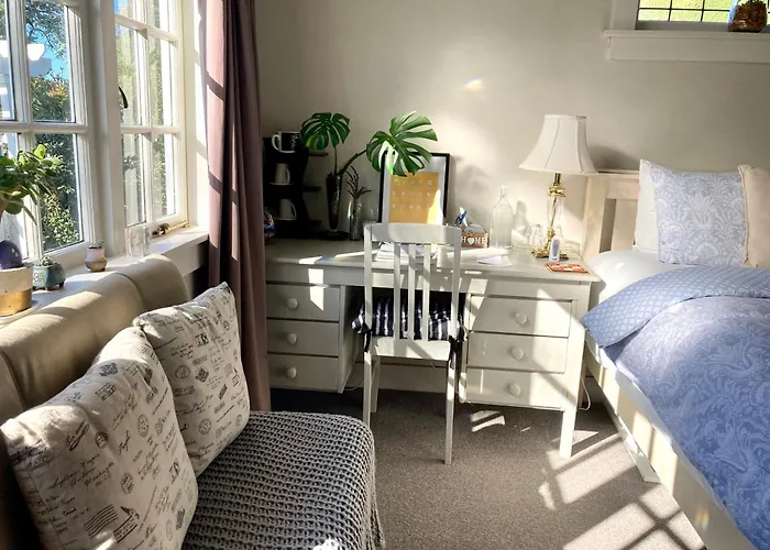 Spacious And Sunny Master Bedroom With Shared Bathrooms