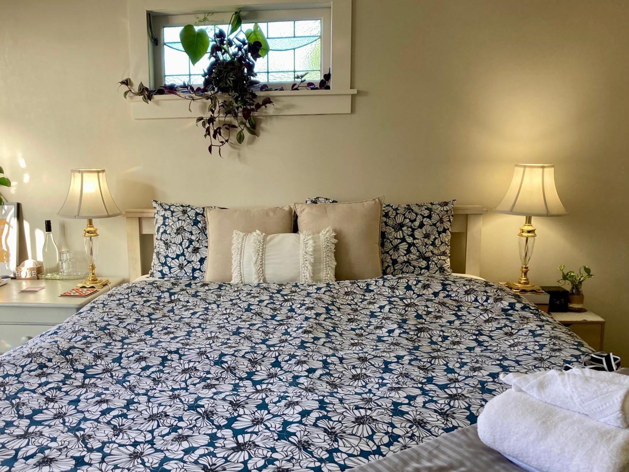 Spacious And Sunny Master Bedroom With Shared Bathrooms