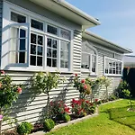 Spacious And Sunny Master Bedroom With Shared Bathrooms